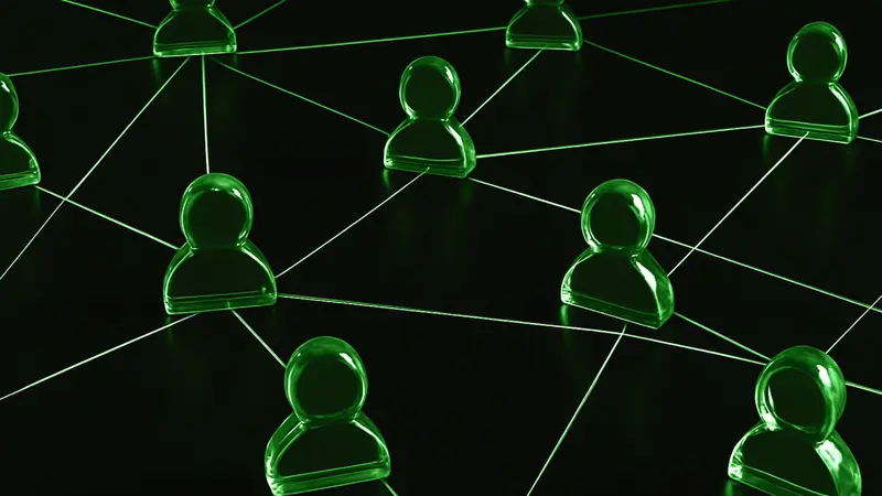 Green glass person figures joined by thin glowing lines on a dark surface, picturing the community network behind DeFi